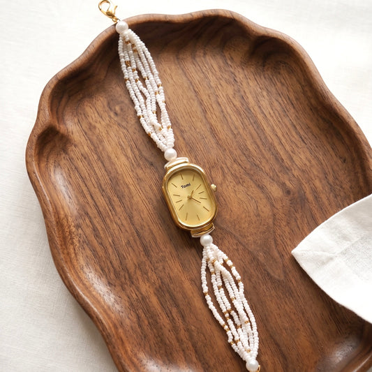 Golden oval moti watch